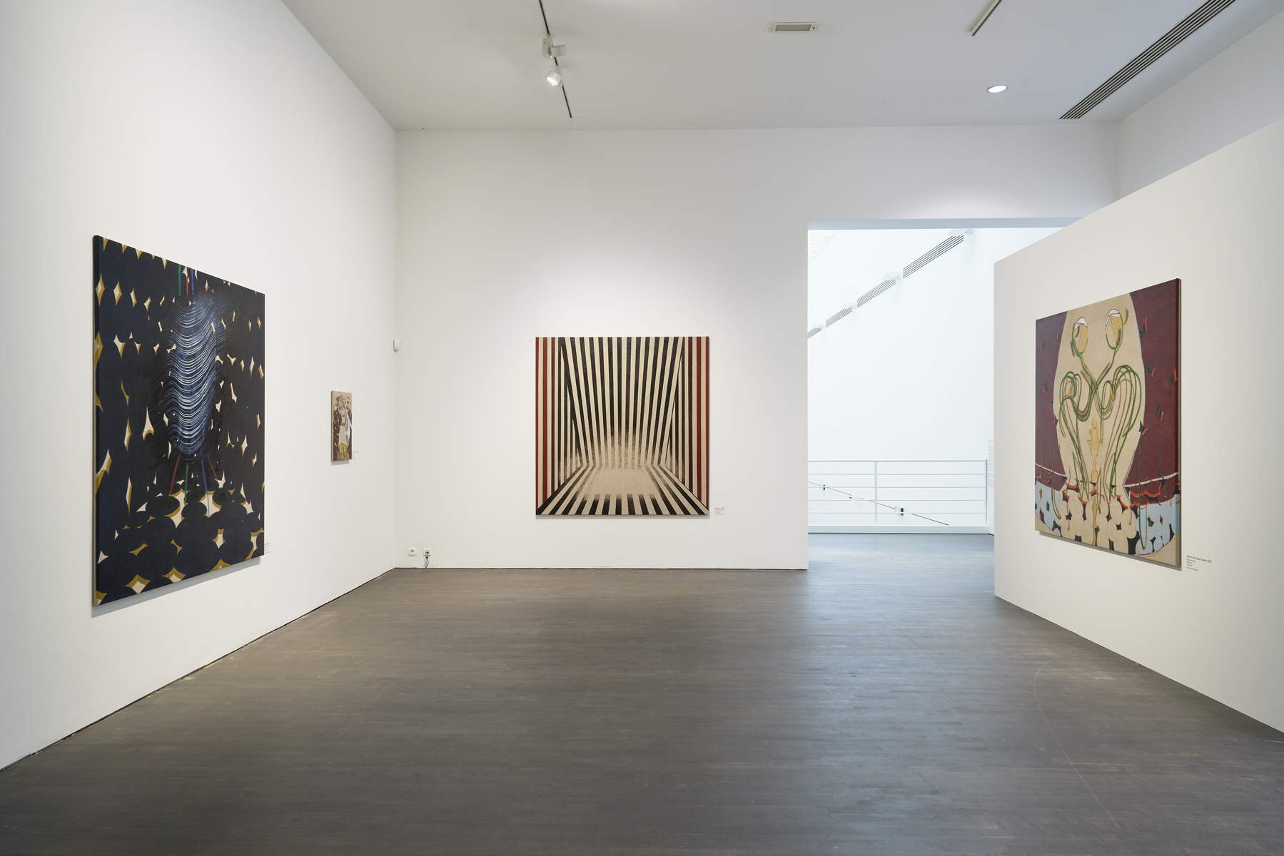 Installation view — gallery room with three paintings
